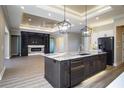 Modern kitchen with large island, stainless steel appliances and fireplace at 17694 Sw 61St Lane Rd, Dunnellon, FL 34432