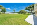 Spacious backyard with lake view and patio at 7451 Sadler Rd, Mount Dora, FL 32757