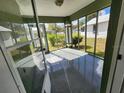 Spacious screened porch with concrete flooring at 645 W 6Th St, Lakeland, FL 33805