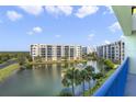 Balcony view overlooking a pond and the community at 5300 S Atlantic Ave # 15-403, New Smyrna Beach, FL 32169