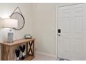 Bright entryway with a console table and mirror at 3982 Lana Ave, Davenport, FL 33897