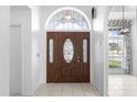 Inviting entryway with wood door and stained-glass window at 2715 Autumn Green Dr, Orlando, FL 32822