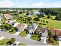 Houses near golf course and pond. Community view at 2715 Autumn Green Dr, Orlando, FL 32822