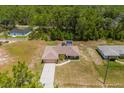 Aerial view of a house and surrounding neighborhood at 33 Fisher Run Ter, Ocklawaha, FL 32179