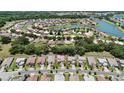 Aerial view of a house among other homes in a community at 3860 Rose Malllow Dr, Kissimmee, FL 34746