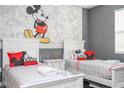 Mickey Mouse themed bedroom with twin beds at 8868 Cabot Cliffs Dr, Davenport, FL 33896