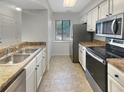 Modern kitchen with stainless steel appliances and granite countertops at 232 Riverbend Dr # 201, Altamonte Springs, FL 32714
