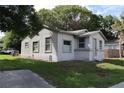 A small house with a front yard, driveway and street view at 2351 S Ronald Reagan Blvd, Altamonte Springs, FL 32701