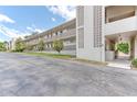 Exterior view of condo building with walkway and landscaping at 700 Melrose Ave # E4, Winter Park, FL 32789