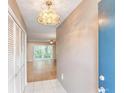 Condo entryway with tiled floor, closet, and view of living room at 700 Melrose Ave # E4, Winter Park, FL 32789
