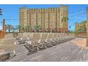 Relaxing pool deck with numerous lounge chairs at 8125 Resort Village Dr # 5405, Orlando, FL 32821