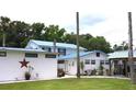 Home with multiple buildings and lush landscaping at 24650 Fox Rd, Astor, FL 32102