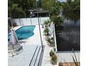 Pool and deck overlooking waterway at 24650 Fox Rd, Astor, FL 32102