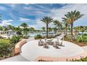 Community pool with fire pit and lounge seating at 2178 Cooper Bell Pl, Kissimmee, FL 34747