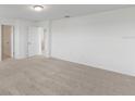 Spacious bedroom with plush carpeting and ample closet space at 1128 Griffon Ave, Lake Alfred, FL 33850