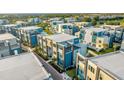 Aerial view of modern townhouses with pool at 7770 Sandy Ridge Dr # 227, Reunion, FL 34747