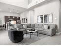Open living room with sectional sofa and kitchen views at 7770 Sandy Ridge Dr # 227, Reunion, FL 34747