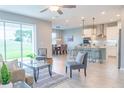 Open concept living and kitchen area with modern design at 30053 Island Club Dr, Tavares, FL 32778