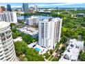 High-rise building with pool and city skyline in background at 530 E Central Blvd # 802, Orlando, FL 32801