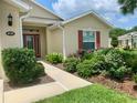 Landscaped front yard with a walkway leading to the house entrance at 4739 Spring Grove Ln, Leesburg, Fl, FL 34748