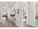 Light and bright hallway with wood-look flooring at 1967 Spring Shower Cir, Kissimmee, FL 34744