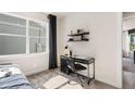 Bedroom with window, desk and chair, and built-in shelves at 1967 Spring Shower Cir, Kissimmee, FL 34744
