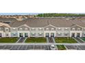 Row of townhomes with landscaping and parking at 3954 Lana Ave, Davenport, FL 33897