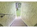 Exterior staircase leading to a grassy area at 8 Escondido Cir # 78, Altamonte Springs, FL 32701