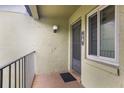 Private entrance with a door, window, and small balcony at 8 Escondido Cir # 78, Altamonte Springs, FL 32701