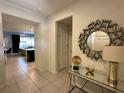 Bright and spacious entryway with mirror and console table at 8940 Sydney Ave, Kissimmee, FL 34747