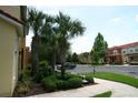 Townhome nestled among palm trees with convenient parking and sidewalk at 8516 Crystal Cove Loop, Kissimmee, FL 34747