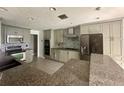 Spacious kitchen with granite countertops and stainless steel appliances at 368 Fairgreen Pl, Casselberry, FL 32707