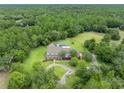 House with pool and large lot surrounded by trees at 1709 Onondaga Dr, Geneva, FL 32732