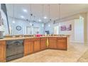 Spacious kitchen with an island, stainless steel appliances, and wood cabinets at 20606 Quinn St, Orlando, FL 32833