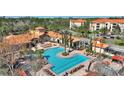 Aerial view of the community pool and surrounding buildings at 1370 Tuscan Terrace # 2205, Davenport, FL 33896