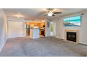 Open living room with fireplace, kitchen and ample space at 320 Black Oak Ct # 107, Altamonte Springs, FL 32701