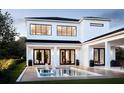 Luxury home with a modern design, featuring a pristine pool and deck at 3304 Harrison Ave, Orlando, FL 32804