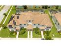 Aerial view of townhouses with solar panels at 1568 Plunker Dr, Davenport, FL 33896