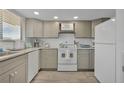 Updated kitchen with granite countertops and modern appliances at 4407 Sea Mist Ct # 267, New Smyrna Beach, FL 32169