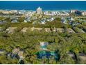 Community overview, showing homes, pool, and tennis court at 4407 Sea Mist Ct # 267, New Smyrna Beach, FL 32169