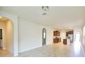 Spacious living room with tile flooring and open floorplan at 16253 Pebble Bluff Loop, Winter Garden, FL 34787