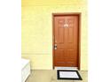 Townhome building's entrance with a brown door at 837 Grand Regency Pt # 207, Altamonte Springs, FL 32714