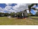 Single-story home with stone accents and a walkway at 3060 Rambler Ave, Saint Cloud, FL 34772