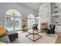 Elegant living room with high ceilings, fireplace, and access to the pool area at 2234 Via Luna, Winter Park, FL 32789