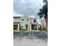 Two-story townhome with front porch and landscaping at 2444 Summerfield Way # 1, Kissimmee, FL 34741