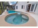 Inviting pool and spa with a view of the house at 1195 Greenley Ave, Groveland, FL 34736