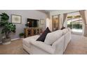 Living room with sectional sofa, access to the pool at 4036 Oakrise Loop, Davenport, FL 33837