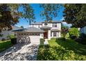 Two-story house with a two-car garage and manicured lawn at 1134 Harbor Hill St, Winter Garden, FL 34787