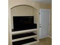 Living room with built-in entertainment center and patio door at 200 Afton Sq # 102, Altamonte Springs, FL 32714