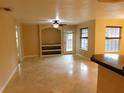 Spacious living room with tile floors and access to patio at 200 Afton Sq # 102, Altamonte Springs, FL 32714